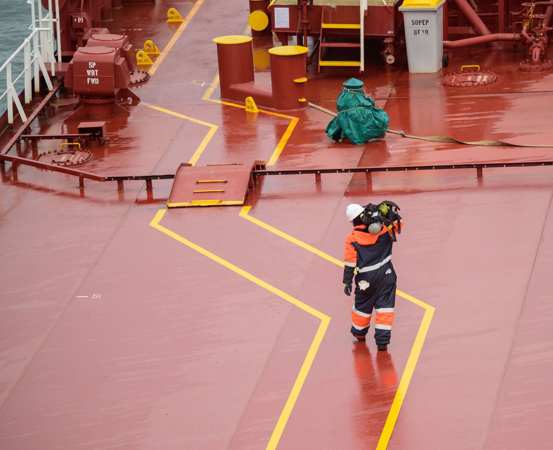 Crew members working on the deck of a tanker