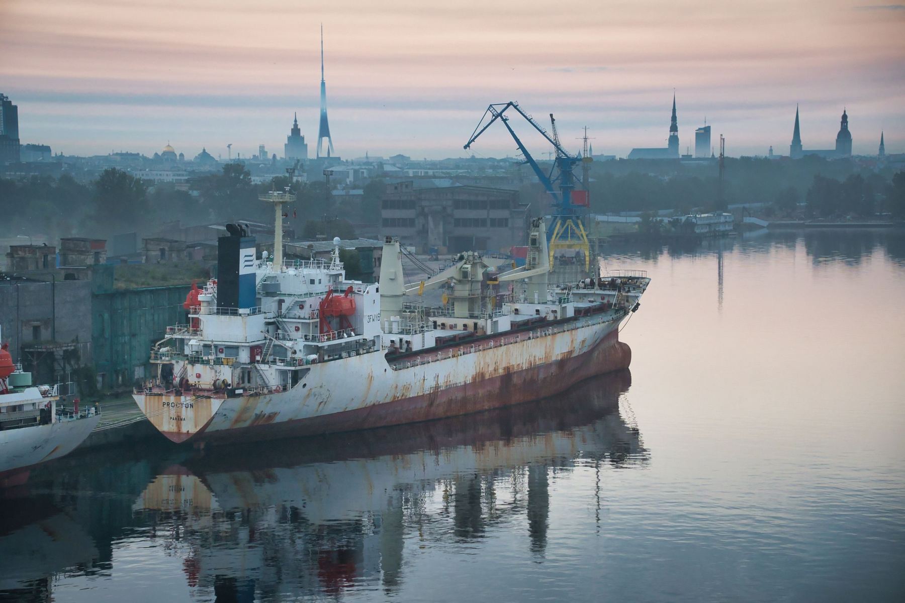 Merchant vessel moored in the port of Riga at dawn